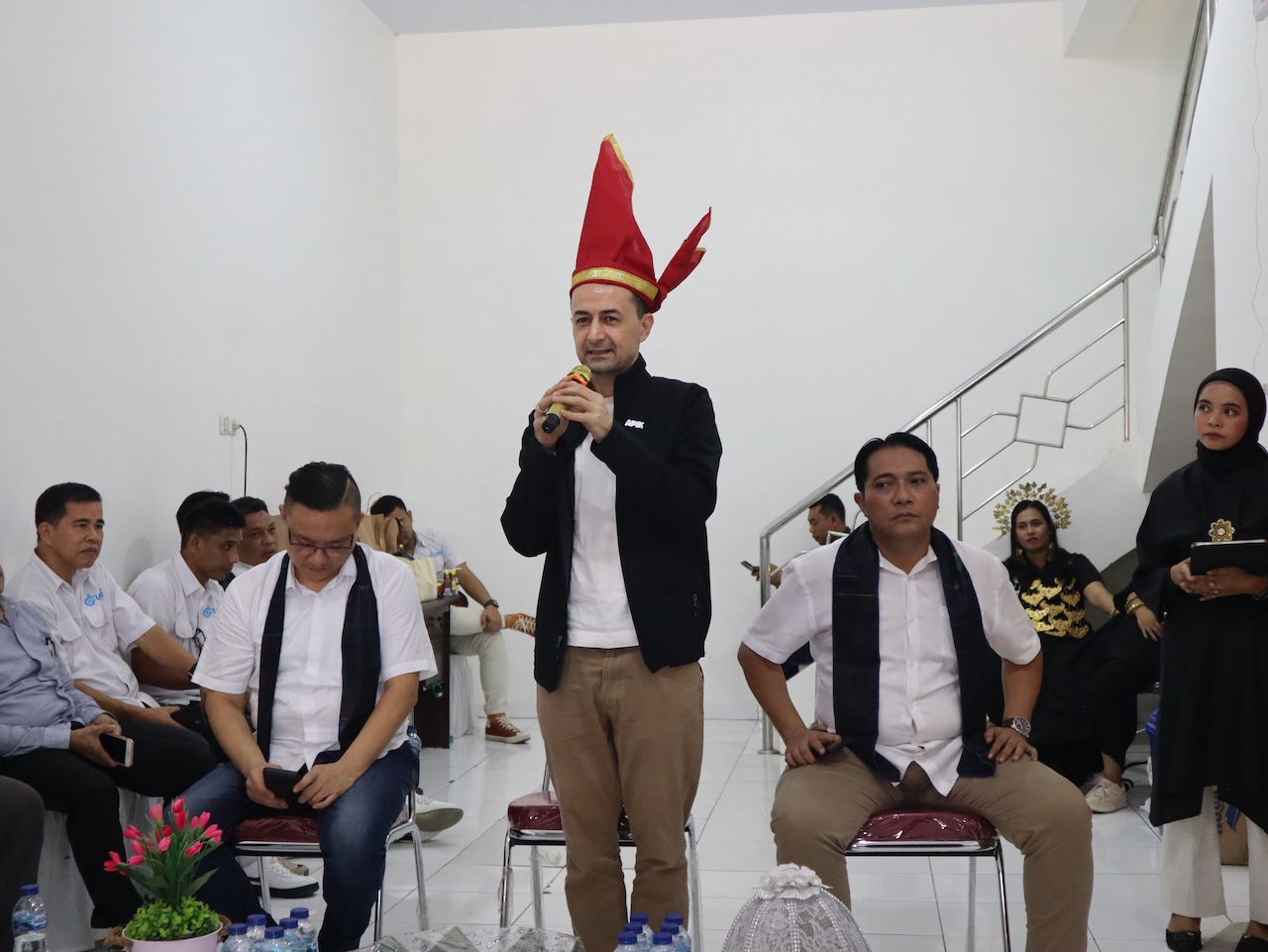 Salis team bonding activity with traditional hat performance